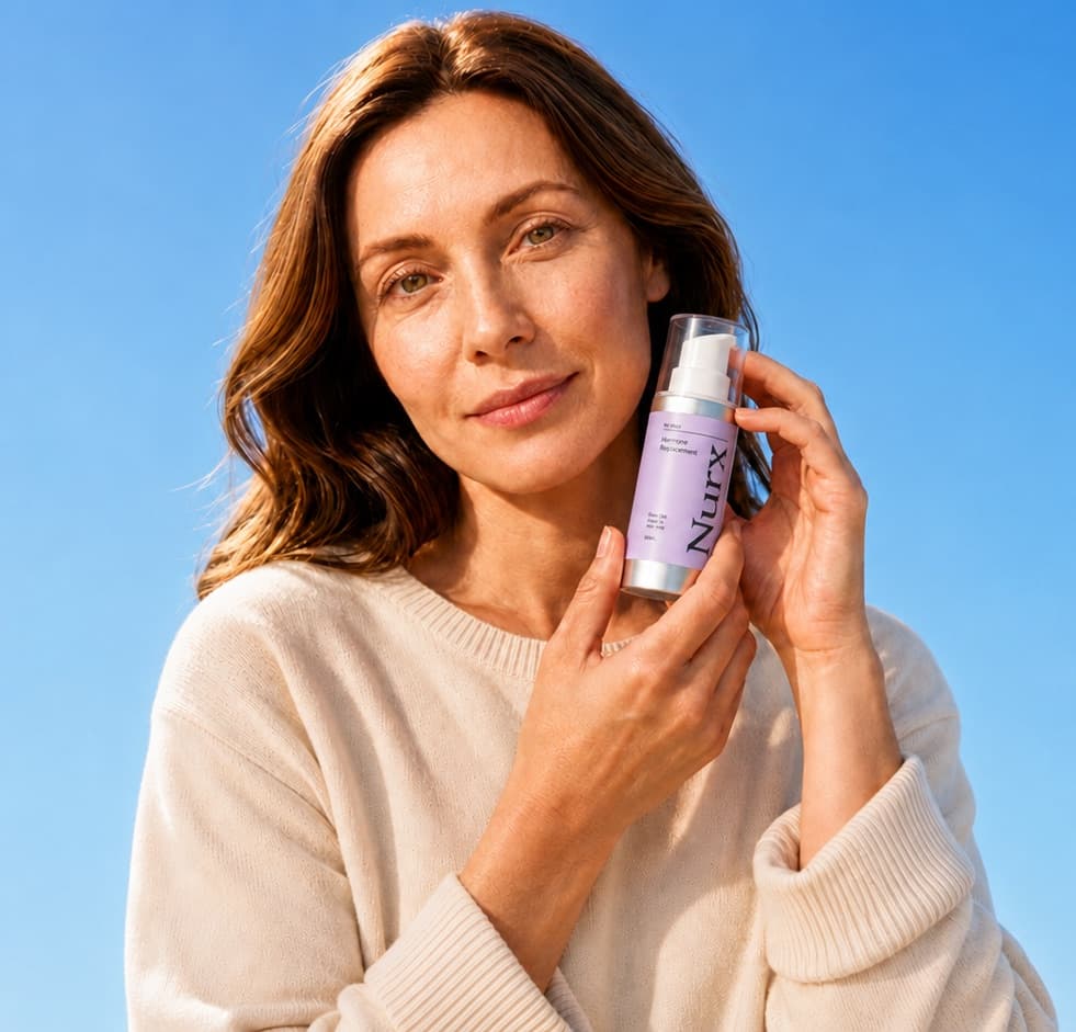 Nurx patient holding a bottle of prescribed hormone therapy